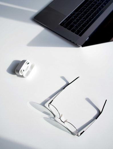 Laptop and glasses on a desk — Josh's Web Services web developer